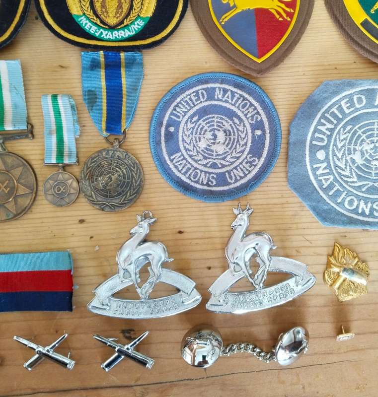 Large collection of military medals, badges and clothing. Please read.