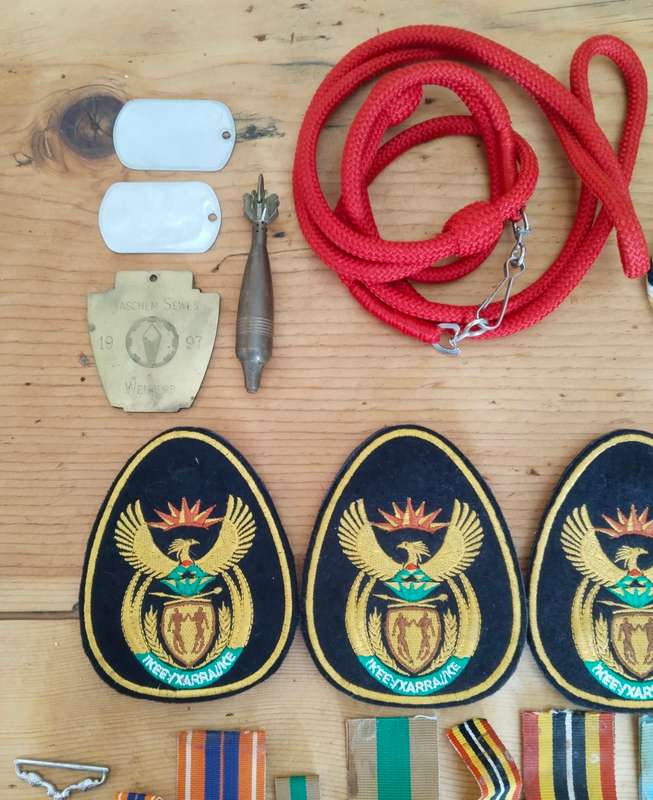 Large collection of military medals, badges and clothing. Please read.