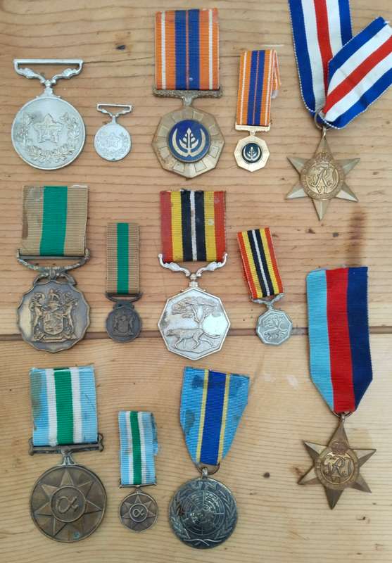 Large collection of military medals, badges and clothing. Please read.