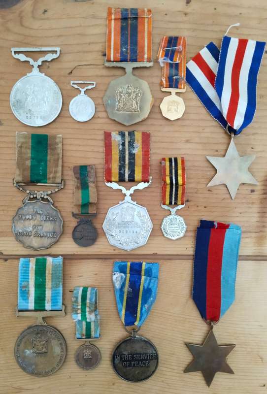 Large collection of military medals, badges and clothing. Please read.