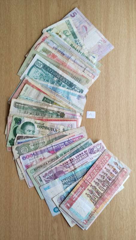 Collection of 50 old bank notes from around the world.