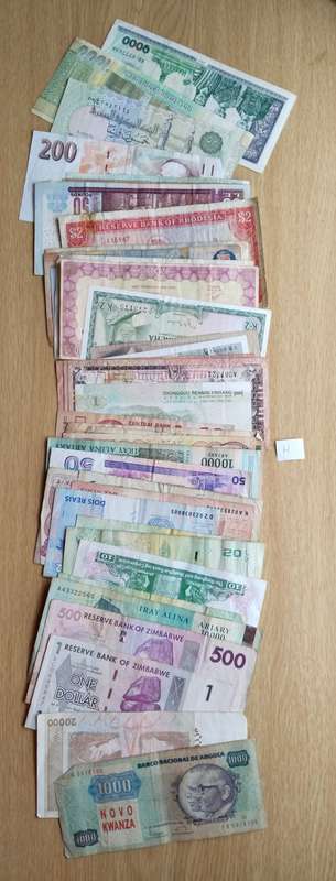 Collection of 50 old bank notes from around the world.