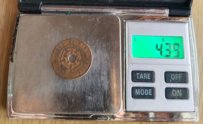 Error Rhodesia one Penny's. Thinner and little smaller in size. Original weight is 6.46 grams.
