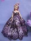 Purple sequenced Barbie doll ball gown dress with butterfly decoration in front