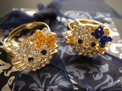 Two gold tone Hello Kitty crystal rings with yellow & blue bows: SPECIAL OFFER & GIFT BOX