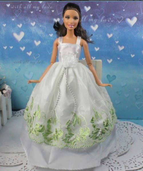 Stunning white Barbie wedding dress with subtle light green lace overlay with chains