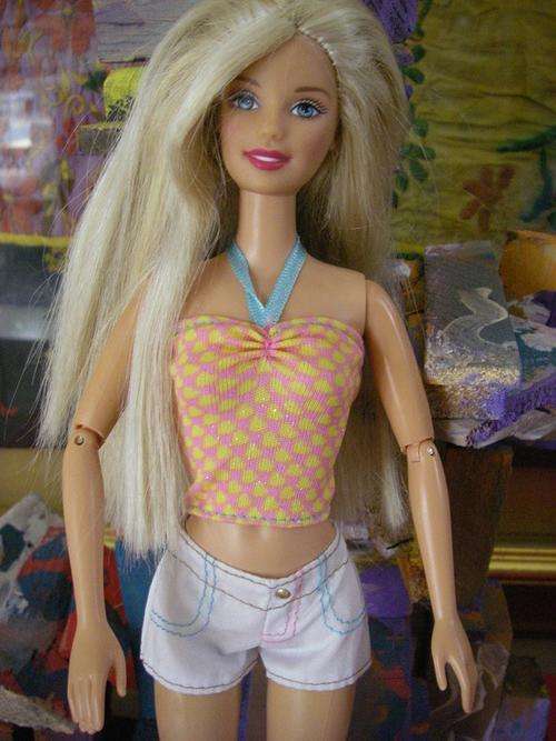 White shorts and pink and yellow heart halterneck top for Barbie dolls.