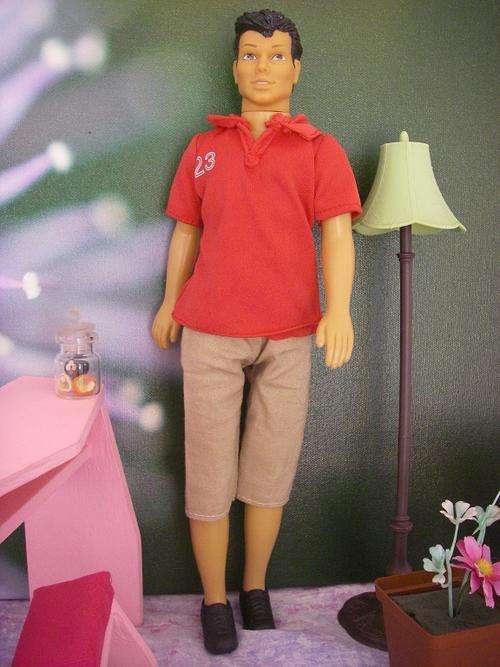 Simba Ken like doll with dark hair. Waist can twist.