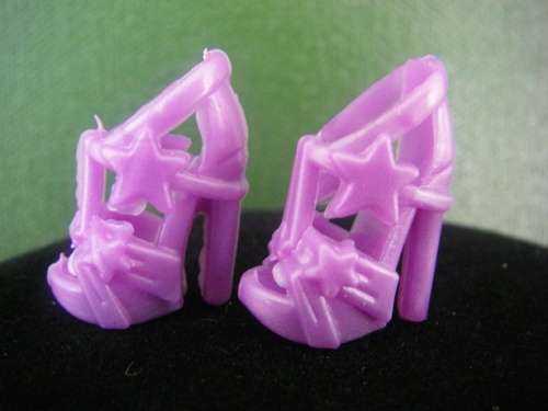 Purple Barbie doll shoes with stars