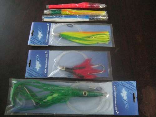 www.h2oprolures.com 36 Fishing Lures  unused still in packets & carrying bags sea fishing