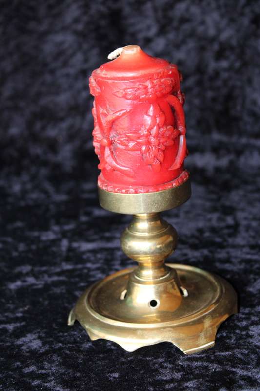 Brass candle holder with candle