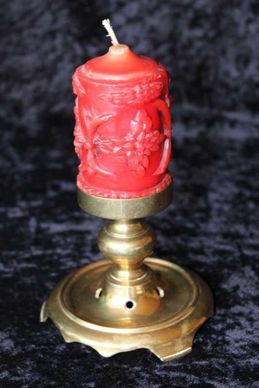Brass candle holder with candle