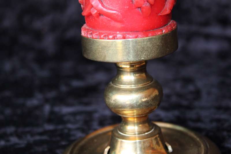 Brass candle holder with candle
