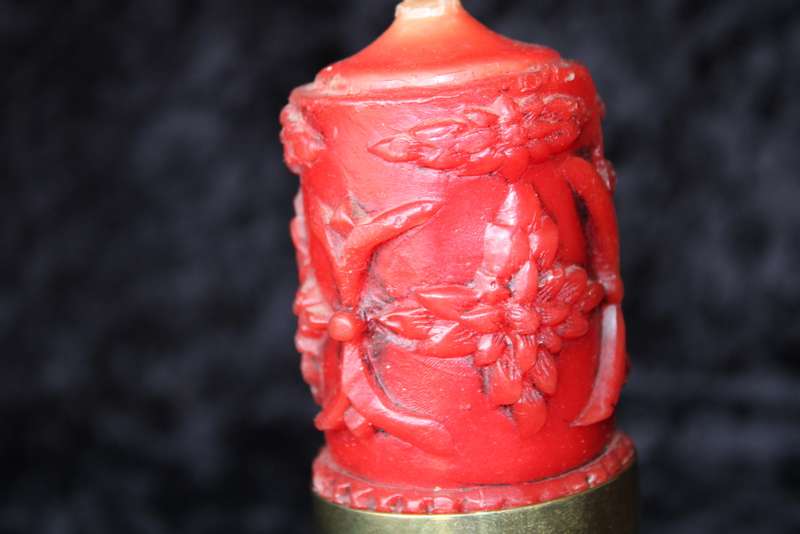 Brass candle holder with candle