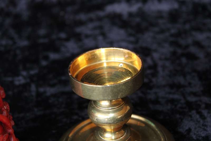 Brass candle holder with candle