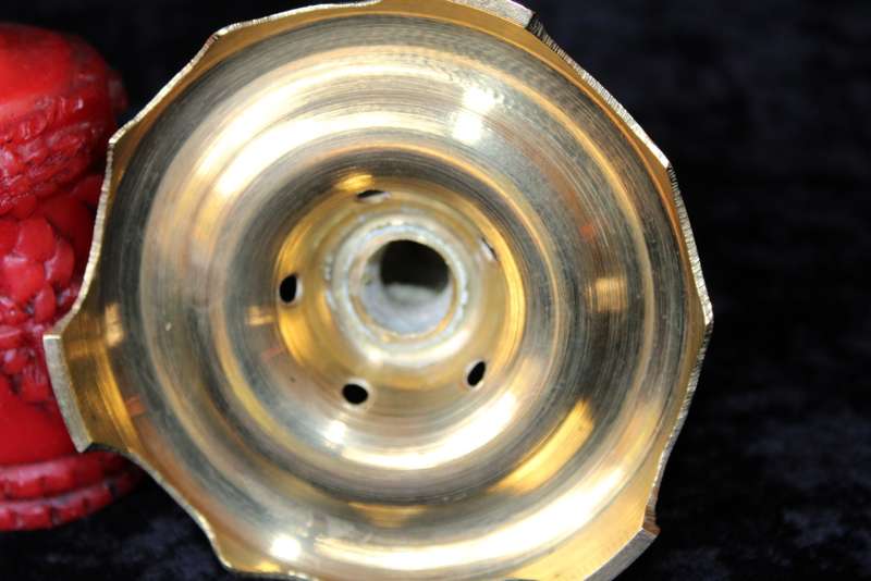 Brass candle holder with candle