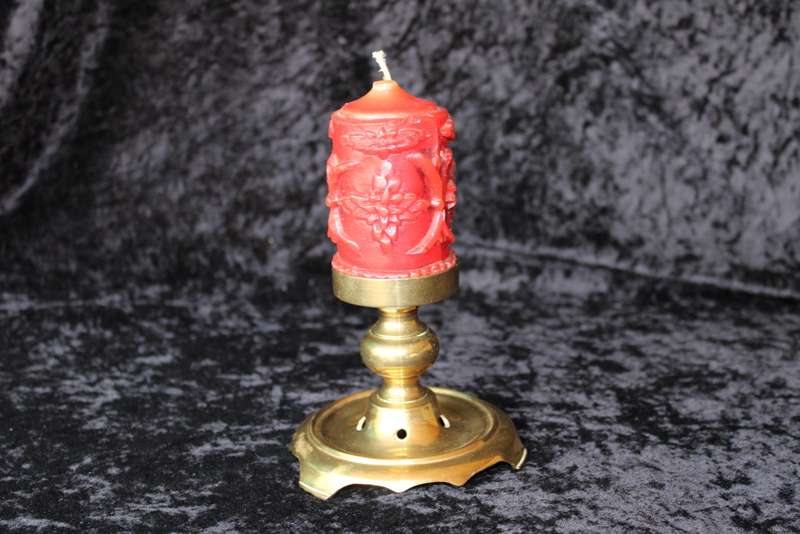Brass candle holder with candle
