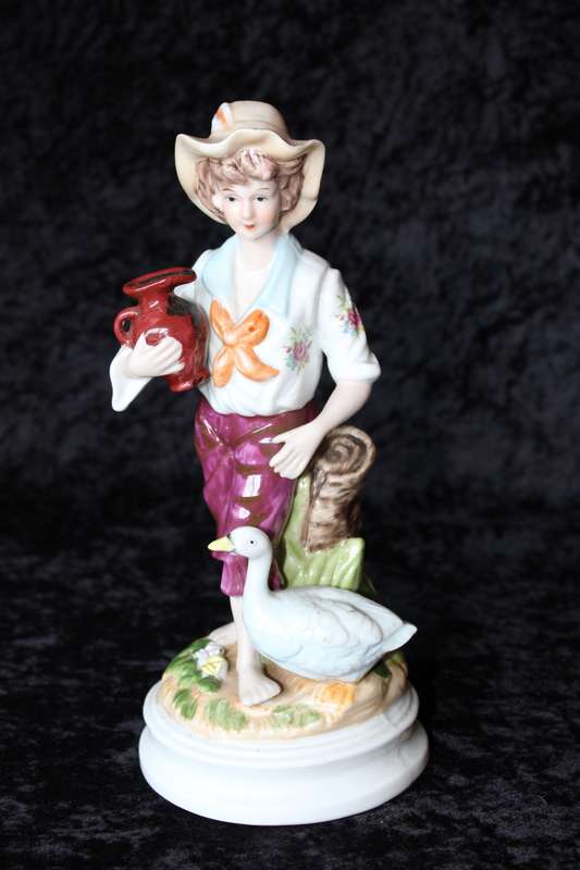 Porcelain Figurine of Boy and Swan