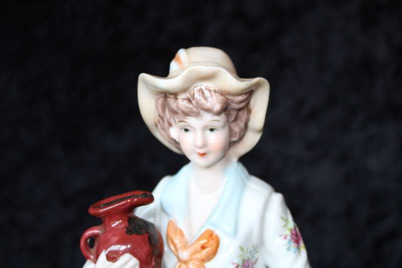 Porcelain Figurine of Boy and Swan