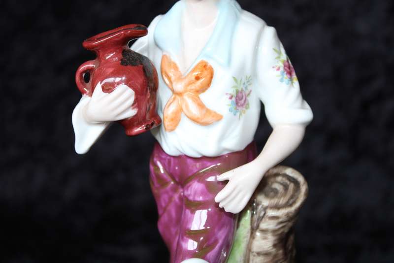 Porcelain Figurine of Boy and Swan
