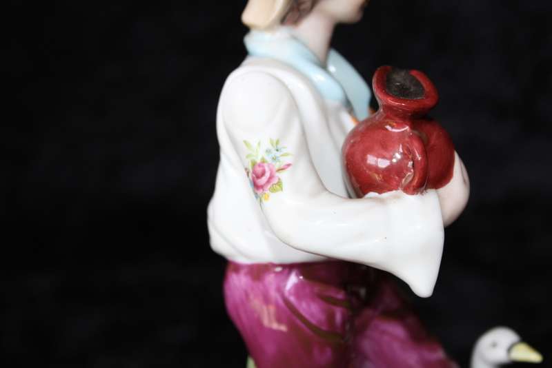 Porcelain Figurine of Boy and Swan