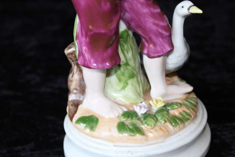 Porcelain Figurine of Boy and Swan