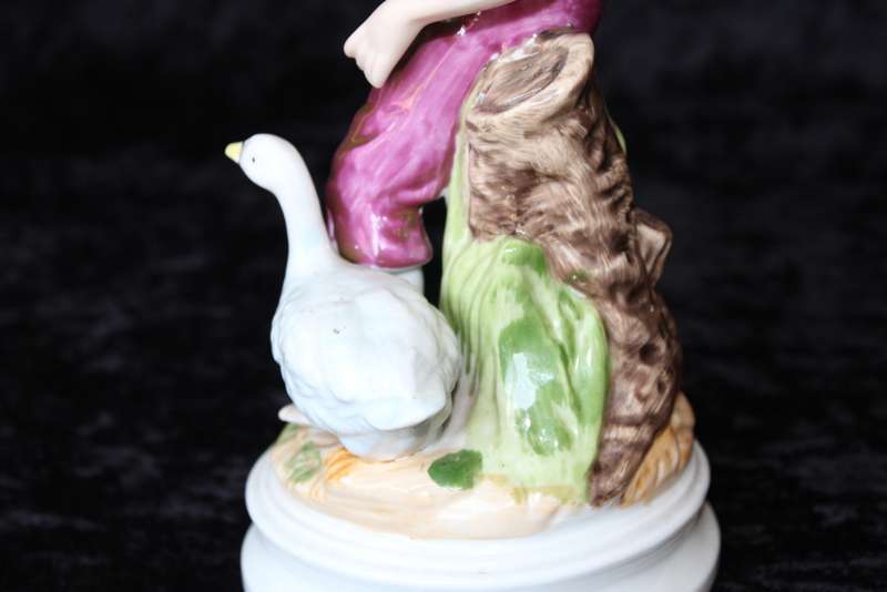 Porcelain Figurine of Boy and Swan