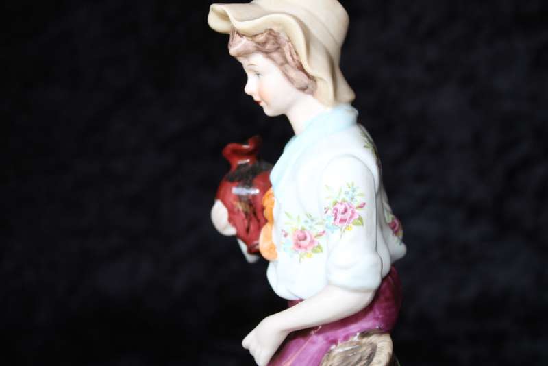 Porcelain Figurine of Boy and Swan