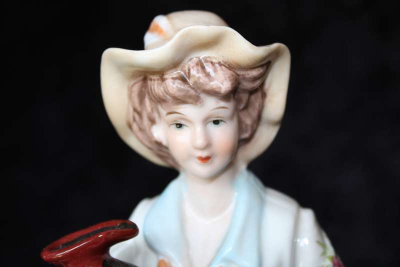 Porcelain Figurine of Boy and Swan