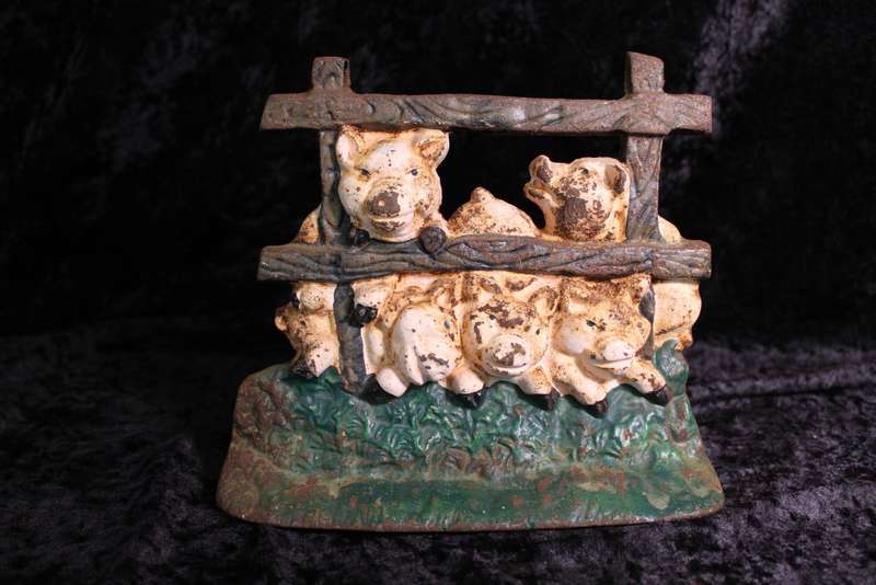 Vintage Cast Iron Pigs in a Den Doorstopper.