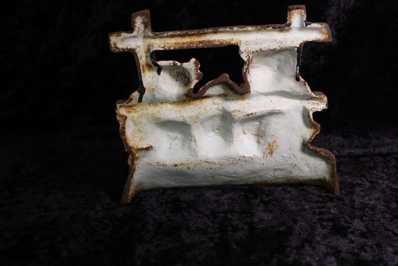 Vintage Cast Iron Pigs in a Den Doorstopper.