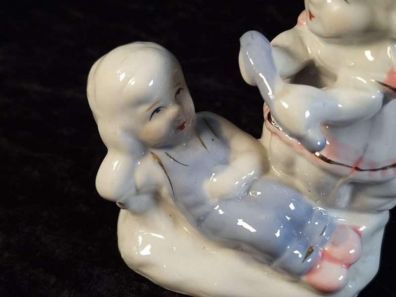 Porcelain Boy and Girl Figurine