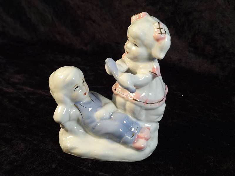Porcelain Boy and Girl Figurine