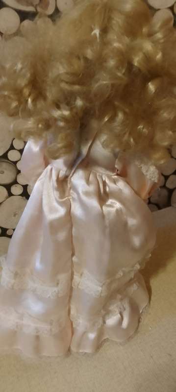PORCELAIN DOLL - Little Miss  Pretty- 40 cm long -ON WOODEN STAND