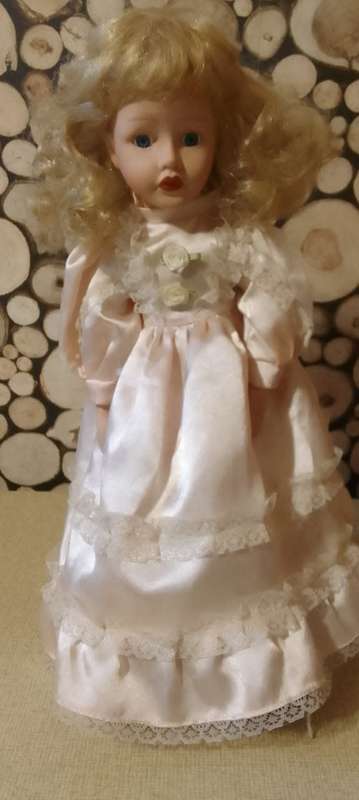 PORCELAIN DOLL - Little Miss  Pretty- 40 cm long -ON WOODEN STAND