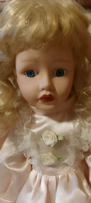 PORCELAIN DOLL - Little Miss  Pretty- 40 cm long -ON WOODEN STAND