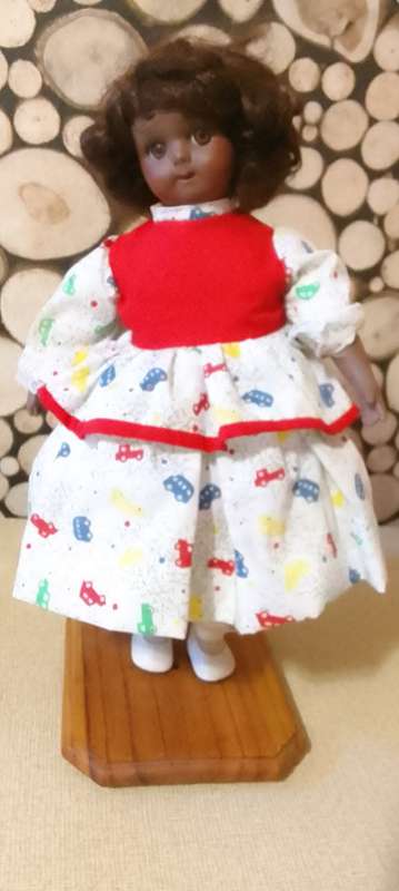 PORCELAIN DOLL - vintage small size- 40 cm long - ON STAND