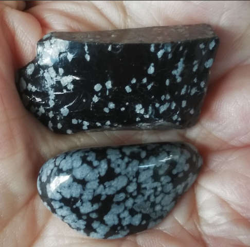 Polished and rough Snowflake Obsidian activates third eye, root and earth chakra
