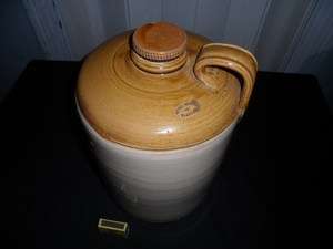 STONEWARE JAR WITH LID.