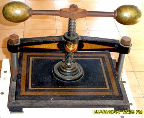 Antique book Press and table.