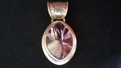 Violet colored semi-precious stone set in 925 sold silver