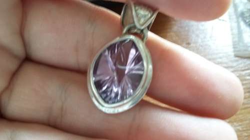 Violet colored semi-precious stone set in 925 sold silver
