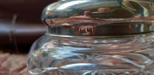 Crystal container with silver lid