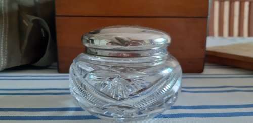 Crystal container with silver lid