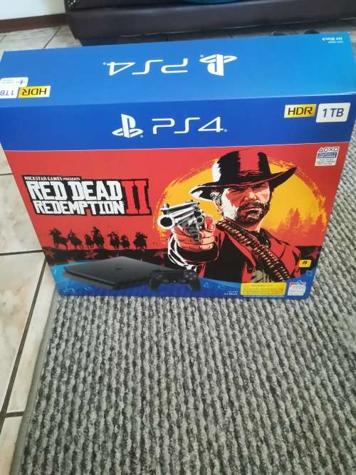 PS4 1TB SLIM CONSOLE + 1 CONTROLLER + 4 GAMES (LIKE NEW, 4 MONTHS OLD WITH GUARANTEE SLIP)