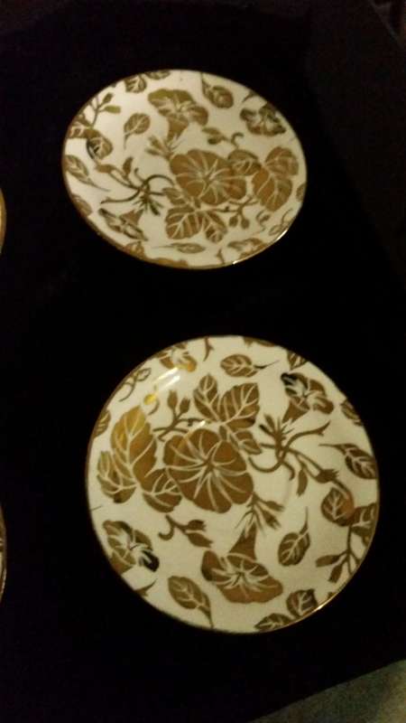 A pair of golden leaf plates