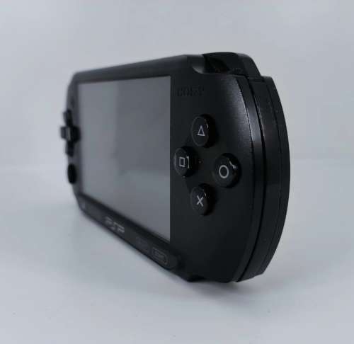 Sony PSP- E1004 with 5 x Games and all accessories, see full description please