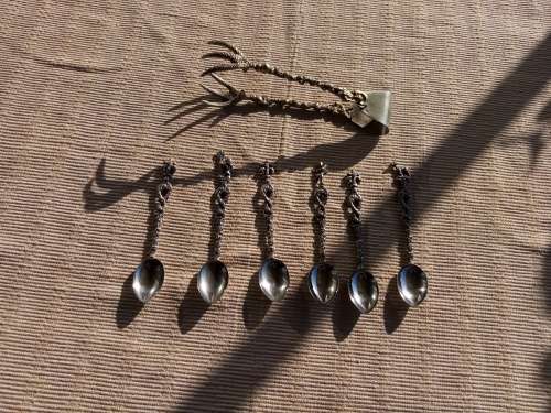 Six Italian coffee spoons and sugar tongues