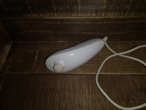 NINTENDO WII WITH 2 CONTROLLERS AND 2 NUNCHUCKS AND TOP SHOT ELITE
