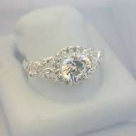 Sterling silver ring with clear cubic zirconia stones with vine effects on sides